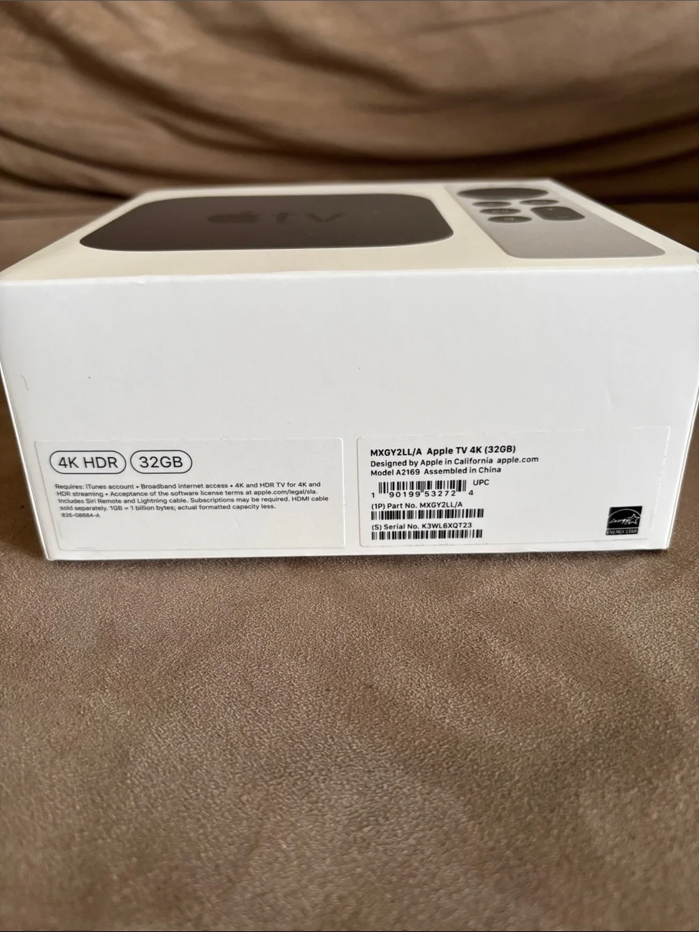 Apple TV with Silver Remote and Black Streaming Box